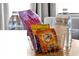 Basket of snacks and water bottles, offering a welcome treat with a personalized housekeeper card at 6165 Carrier Dr # 3512, Orlando, FL 32819