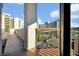 Enjoy city views from this balcony, protected by safety netting and framed by sturdy columns at 6165 Carrier Dr # 3512, Orlando, FL 32819