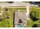 Aerial view of the property showing the house layout, roof, driveway, and the surrounding lush greenery at 6651 Sylvan Woods Dr, Sanford, FL 32771