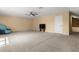 Bonus room with carpet, a ceiling fan, television set and one chair at 6651 Sylvan Woods Dr, Sanford, FL 32771