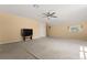 Bonus room with carpet, ceiling fan, one window and a television at 6651 Sylvan Woods Dr, Sanford, FL 32771