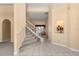 Bright foyer featuring tile floors, staircase, and decorative niche, offering a welcoming entrance at 6651 Sylvan Woods Dr, Sanford, FL 32771