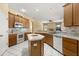 Open kitchen featuring white appliances, center island and view into living room at 6651 Sylvan Woods Dr, Sanford, FL 32771