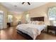 Main bedroom featuring a ceiling fan, ample closet space, and plenty of natural light at 6651 Sylvan Woods Dr, Sanford, FL 32771