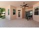 The screened patio features tiled floors, a ceiling fan and has access to the backyard at 6651 Sylvan Woods Dr, Sanford, FL 32771