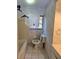 Bathroom with tub and shower combination, toilet, and window at 7438 Vivian Ln, Orlando, FL 32818