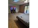 Bedroom featuring a television, skylight, and slider at 7438 Vivian Ln, Orlando, FL 32818