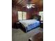 Bedroom featuring a decorative headboard and window view at 7438 Vivian Ln, Orlando, FL 32818