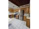 Kitchen featuring stainless steel appliances, ample counter space, and wood-paneled cabinets at 7438 Vivian Ln, Orlando, FL 32818