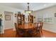 A well-lit dining room featuring a wooden table, seating for six, and a hutch for storage and decor at 801 Silver Dr, Orlando, FL 32804