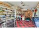 Organized garage featuring work benches, tool racks, shelving, and ample storage space at 801 Silver Dr, Orlando, FL 32804