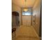 Inviting foyer with high ceilings, decorative tile floor design and elegant chandelier lighting at 938 Cherry Valley Way, Orlando, FL 32828