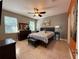 Relaxing primary bedroom with tile floor, ceiling fan, and soothing color palette at 938 Cherry Valley Way, Orlando, FL 32828