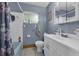 A functional bathroom with a white vanity, toilet, and bathtub with shower, providing essential amenities at 941 Grey Oak Ct, Orlando, FL 32809