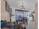 Cozy dining area featuring a chandelier and backyard view at 941 Grey Oak Ct, Orlando, FL 32809