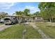 Single-story house featuring a covered parking area and well-lit exterior at 941 Grey Oak Ct, Orlando, FL 32809