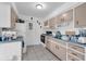 Functional kitchen featuring light-colored cabinets and tile flooring at 941 Grey Oak Ct, Orlando, FL 32809