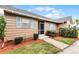 Quaint home featuring a tidy landscaped yard, screen door, and light blue shutters at 1234 Villa Ln # S, Apopka, FL 32712