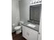 Bathroom with gray countertop, white vanity, and toilet at 12546 Britwell Ct, Orlando, FL 32837