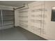 Garage offers ample storage space with installed shelving, enhancing organization and functionality at 12546 Britwell Ct, Orlando, FL 32837