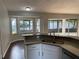 Kitchen featuring stainless steel sink, dishwasher, white cabinets and gray countertops at 12546 Britwell Ct, Orlando, FL 32837