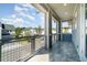 This outdoor balcony features tile floors, metal railings, and neighborhood views at 12849 Bovet Ave, Orlando, FL 32827