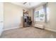 Neutral bedroom with an office setup, soft carpet, and a bright window at 12849 Bovet Ave, Orlando, FL 32827