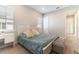 Cozy bedroom with comfortable bed, soft lighting, and carpeted floors at 12849 Bovet Ave, Orlando, FL 32827