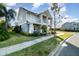 Inviting two-story home featuring a well-manicured lawn and charming landscaping, a true outdoor delight at 12849 Bovet Ave, Orlando, FL 32827