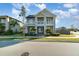 Charming two-story home featuring dual balconies, manicured lawn and lush landscaping for great curb appeal at 12849 Bovet Ave, Orlando, FL 32827