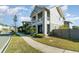 Lovely two-story home featuring a well-maintained lawn, lush landscaping, and a welcoming sidewalk at 12849 Bovet Ave, Orlando, FL 32827