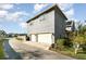 Modern two-story home with a two-car garage and a well-manicured lawn at 12849 Bovet Ave, Orlando, FL 32827