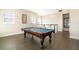 Bright game room with a pool table and seating area on the upper level at 12849 Bovet Ave, Orlando, FL 32827