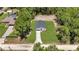 An aerial view of a new home with a spacious, green lawn surrounded by mature trees at 13457 Sw 53Rd St, Ocala, FL 34481