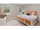Bright bedroom featuring a textured headboard and a beautiful view from the windows at 13457 Sw 53Rd St, Ocala, FL 34481