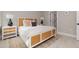 Stylish bedroom with a white framed bed, woven headboard and matching night stands at 13457 Sw 53Rd St, Ocala, FL 34481