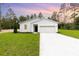 Charming one-story home featuring a well-manicured lawn, attached two car garage, and modern curb appeal at 13457 Sw 53Rd St, Ocala, FL 34481