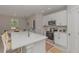 Bright kitchen featuring a center island with bar stool seating, modern appliances and an adjacent dining area at 13457 Sw 53Rd St, Ocala, FL 34481