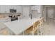 Modern kitchen with white cabinets, stainless steel appliances, and a large center island with seating at 13457 Sw 53Rd St, Ocala, FL 34481