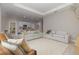 Bright open-concept living room with two couches, open to the kitchen with a center island at 13457 Sw 53Rd St, Ocala, FL 34481