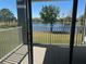 Balcony view of serene lake and trees, offering a peaceful outdoor retreat for relaxation and enjoyment at 13929 Fairway Island Dr # 822, Orlando, FL 32837