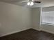 A bedroom with hard wood floors and a ceiling fan at 13929 Fairway Island Dr # 822, Orlando, FL 32837