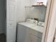 A bright laundry room with a washer and dryer at 13929 Fairway Island Dr # 822, Orlando, FL 32837