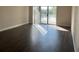 Spacious living room with wood-look floors and sliding glass doors leading to the outside at 13929 Fairway Island Dr # 822, Orlando, FL 32837