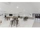 Conference room with tables, stools, and gray tile flooring at 151 E Washington St # 408, Orlando, FL 32801