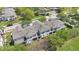 Aerial view of townhomes featuring gray rooftops and green outdoor spaces at 1613 Priory Cir, Winter Garden, FL 34787