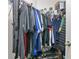 Well-organized closet with shelving and hanging space for clothes and shoe storage at 1613 Priory Cir, Winter Garden, FL 34787