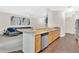 Kitchen area with wooden cabinets and countertops overlooking the living area at 1613 Priory Cir, Winter Garden, FL 34787