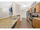 Modern kitchen featuring granite countertops, stainless steel appliances, and wood flooring at 1613 Priory Cir, Winter Garden, FL 34787