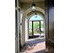 Elegant entryway with arched doorway, decorative lighting, and brick flooring at 225 Vestrella Dr, Kissimmee, FL 34759